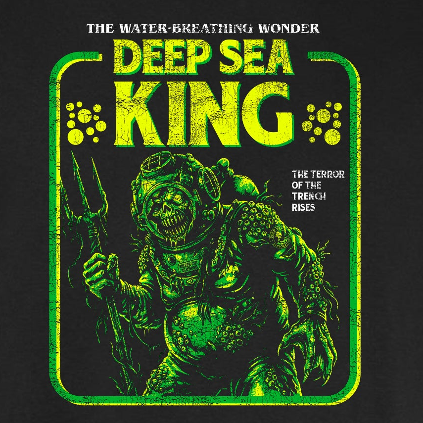 Deep Sea King vintage horror graphic tee featuring a disfigured barnacle-covered figure in an old diving suit in green and yellow on a black Comfort Colors tee.
