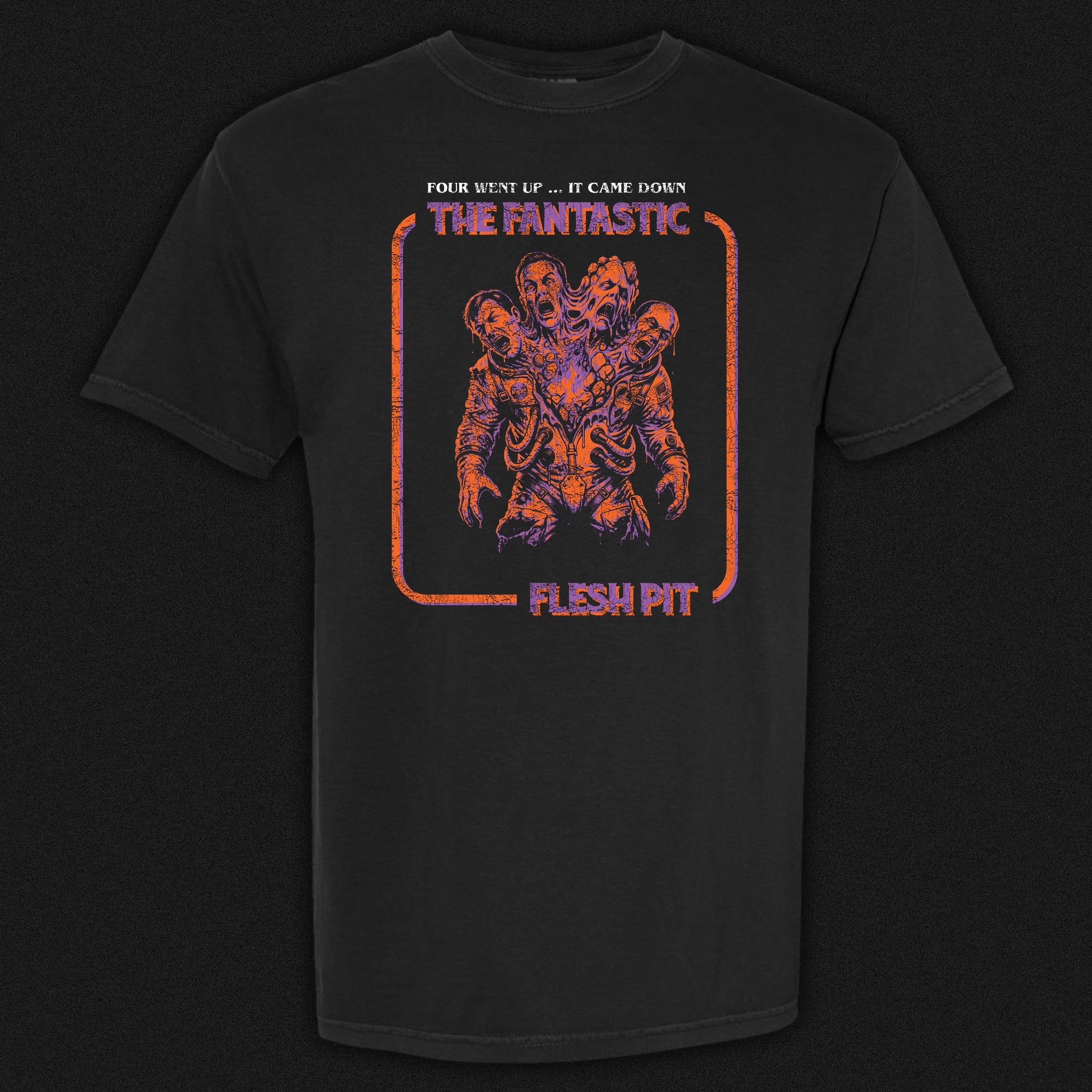 The Fantastic Flesh Pit vintage horror graphic tee featuring a merged astronaut monstrosity in purple and orange on a black Comfort Colors tee.