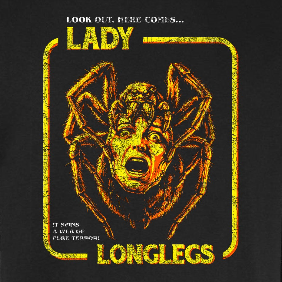 Lady Longlegs vintage horror graphic tee featuring a giant spider with a screaming woman's face in orange and yellow on a black Comfort Colors tee.