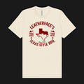 Beige t-shirt with red 'Leatherface's Texas Style BBQ' graphic on a natural color tees