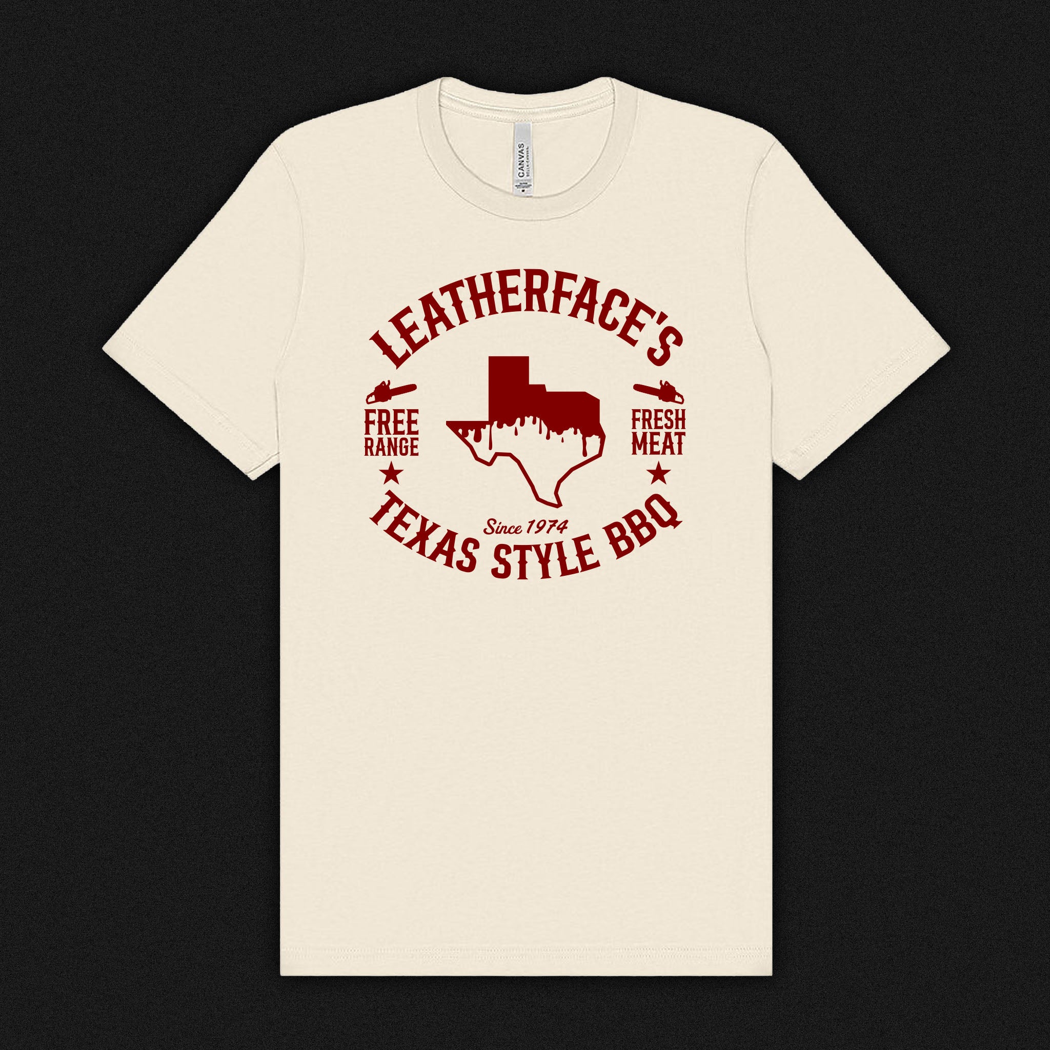 Beige t-shirt with red 'Leatherface's Texas Style BBQ' graphic on a natural color tees